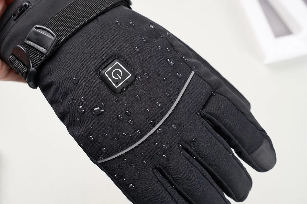 Close-up of the power button on the back of the glove